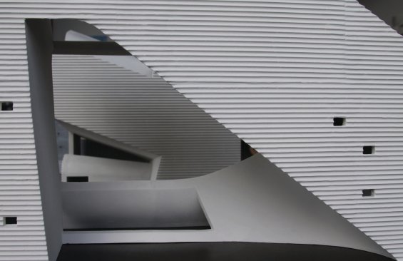 A close-up of the model shows contrasts in materiality and texture between interior and exterior surfaces.