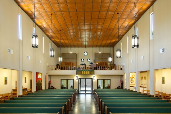 The old ceiling had sagging, mineral fiber panels that had been badly stained by water from roof leaks and by incense used in the worship. 