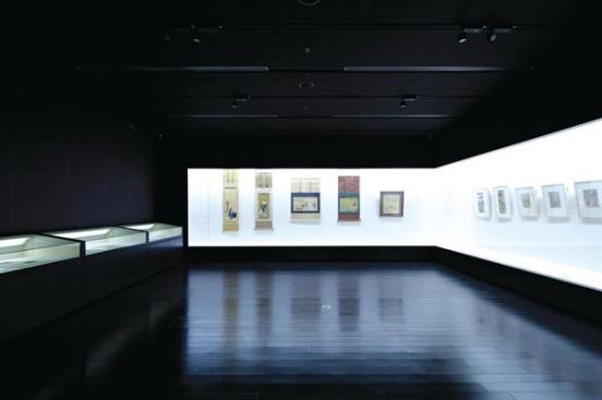 Pieces from the university's collection of Ukiyo-e prints are rotated from off-site storage and into carefully crafted display cases in one the musem's galleries. With black-stained wood floors, and black-painted walls and ceiling, the focus in the room is placed squarely on these "pictures of the floating world."