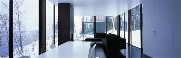 Living and dining area with view to studio beyond