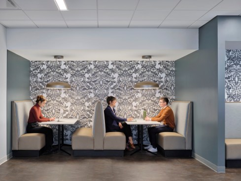 Booths in the communal café encourage a collegial atmosphere.