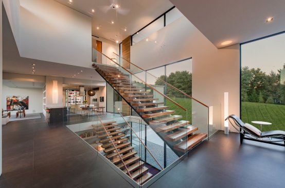 Walker Road modern open volume home three story floating stairs staircase