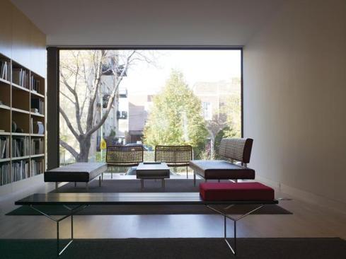 The cinematic view of the street can be shut off with an electrically controlled shade hidden in a ceiling recess.