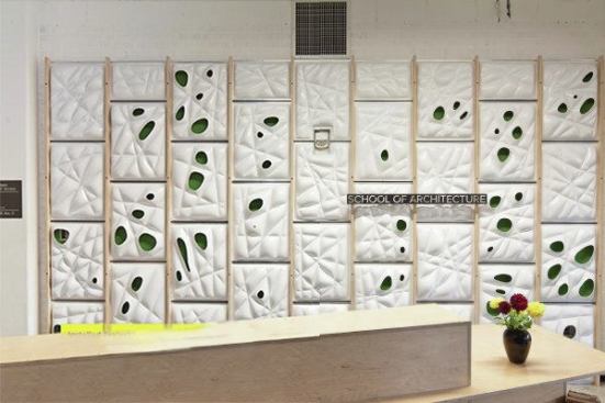 The VarVac Wall is installed in front of the reception desk in the University of Minnesota School of Architecture.