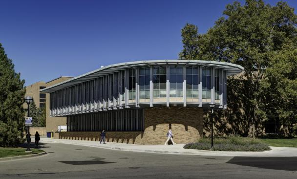 The+LEED+gold-certified+building+addition+to+the+Michigan+Memorial+Phoenix+Laboratory+is+rounded+in+front.+The+two-story+exposed+steel+structure+is+clad+with+red+brick+and+glass+on+the+ground+floor+and+a+glass+curtain+wall+wrapped+around+the+upper+floor%e2%80%99s+east%2c+south+and+west+facades.+