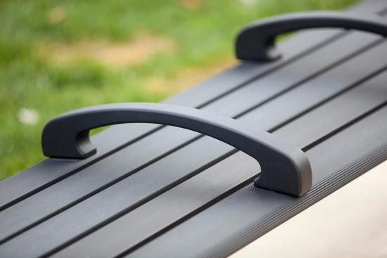 Trio Bench shown in 6 foot, backless configuration with Black Texture powdercoated frame, extruded aluminum slats and two armrests at BART, Pleasant Hill/Contra Costa Centre Station, Walnut Creek, California