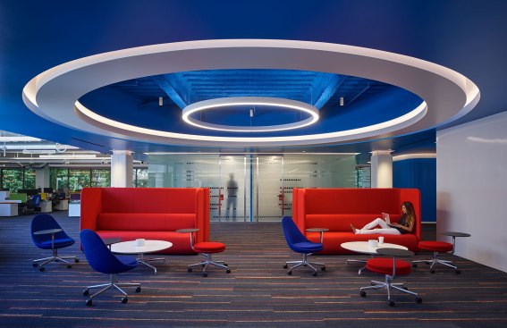Circular coves and direct/indirect pendants are used to define the break areas. Discreetly located downlights add a third layer of illumination.