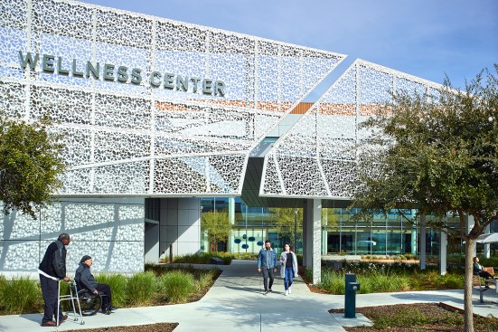 Exterior view of metal art screen, easily accessible walkways and gardens