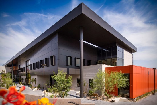 The building takes advantage of the existing site slope, creating carved out 
outdoor spaces, that become cooler areas of respite for faculty and students while responding to the overall campus master plan.