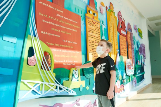 Designed to accommodate additional families coming for care at Cincinnati Children's Critical Care Building, the Ronald McDonald House expansion nestles into its urban context.