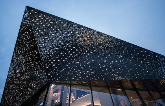 A script was used to punch a computer-generated pattern of holes through the stainless steel of the canopy.