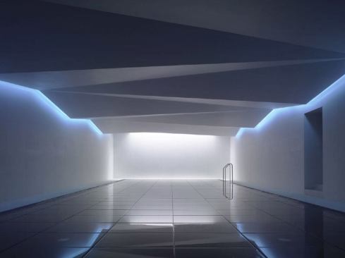 The pool itself is lit from two sides by banks of narrow-beam cool white LEDs to enhance the tinted water's blue hue. This lighting solution was implemented after a 'raise and lower' pool floor was introduced that covered the existing pool floodlights. The pool was already cast prior to the lighting designer's involvement, so the fittings were installed through the overflow channel.