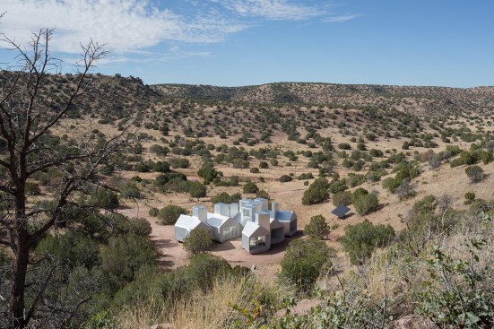 The house relies on solar panels for electricity and an on-site well for water