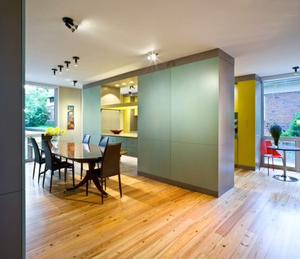 The dining area. Wood flooring throughout the house is locally salvaged heart pine.