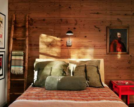 With sustainability and continuity in mind, the design incorporates salvaged lumber from the original home.