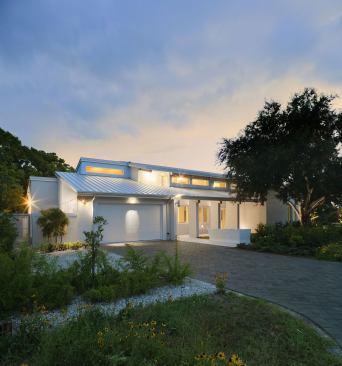 Native wildflower pasture grass makes up 95% of the yard, which is certified by the Florida-Friendly landscape program of the University of Florida’s Department of Environmental Horticulture. A rainwater-only fountain, which separates the front porch from the street, shuts off if there is no rain for three weeks.