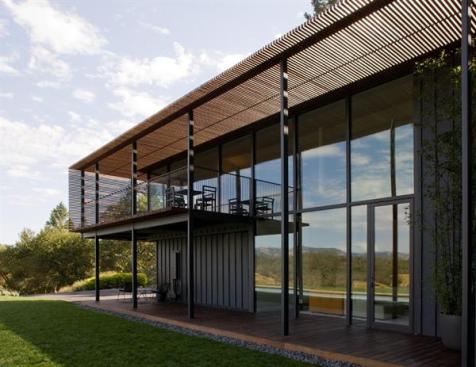 Ipe slats act as a sunscreen for the porch, which functions as an extension of the upper level's living space.