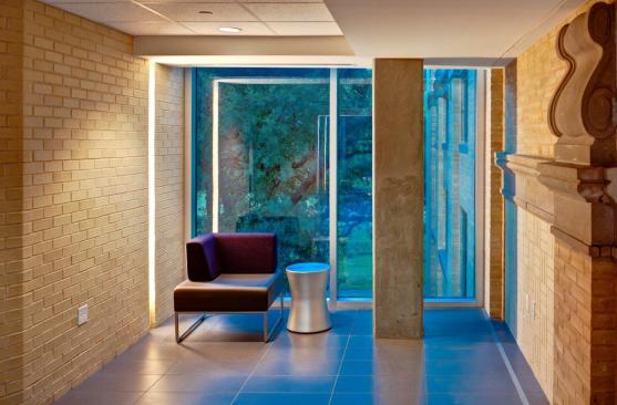 Lobby area - existing corkels from original structure provide historical reference at right