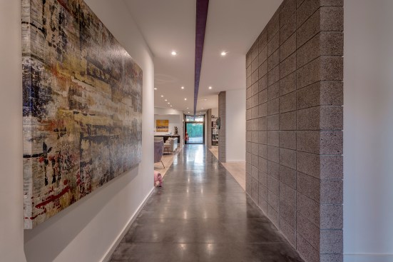 The angle of roof allows the interior spaces to open up to the views beyond without cutting off the tops 
of the mountains in the distance while also forcing the roof water back towards two rain water collection main 
points.  The simplicity of the roof design helps create a straight forward rain collection system. 