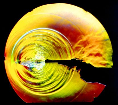 Figure 2: Shock wave visualization from a bullet fired from a pistol as a reenactment of a schlieren technique experiment from the late nineteenth century (photo by Gary S. Settles).