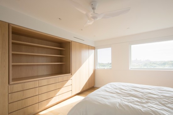 Custom built-in wardrobes and dresser in bedroom