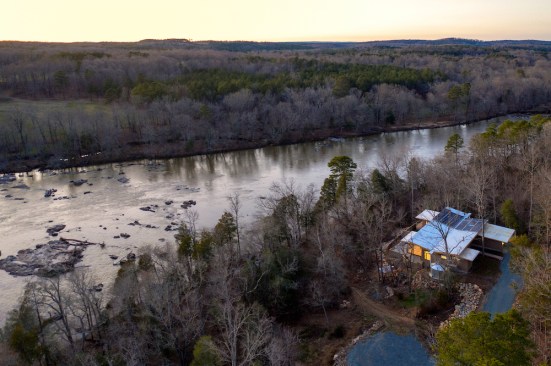 The Haw River is protected by a 100-foot riparian zone that forbids development. The homeowners found a thin strip of land along a bend in the river. 