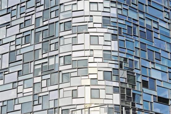 The exteriors of the steel ??megapanels?? that hold the windows are finished with angled aluminum extrusions, heightening the visual intricacy.