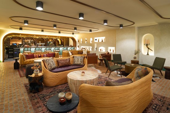 The upper mezzanine level boasts a private, intimate speakeasy for guests looking to unwind. 