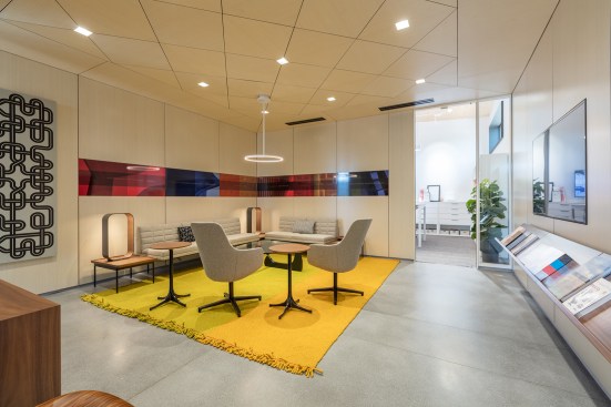Programmed spaces within the showroom include an open office environment complete with meeting rooms, a business center, private offices, a design library, a living room, kitchen space and an outdoor showroom / patio space.  