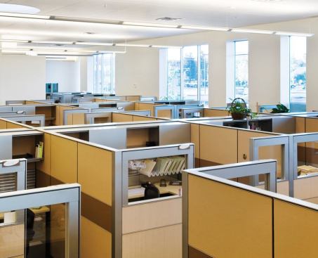 The tenants relocated from largely closed-plan environments to a much more open-plan space. Standardsized cubicles were used in offices in all five buildings to ensure that as departments grow and shrink over time, the furnishings can be reused.