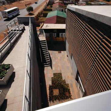 A garden court serves as a gathering space and helps bring natural light into the adjacent clinic.