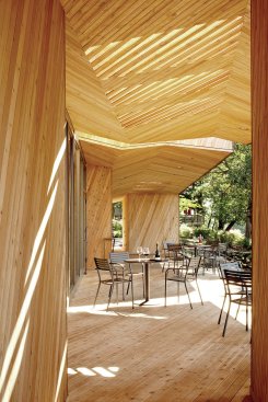 View of the outdoor seating area with its slatted canopy.