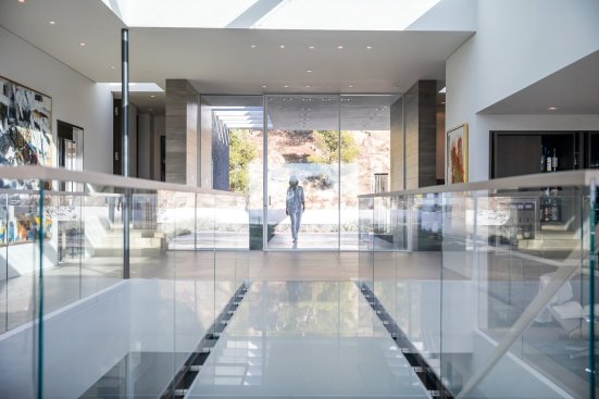 Beverly Hills modern luxury home with glass bridge walkway and skylights.  