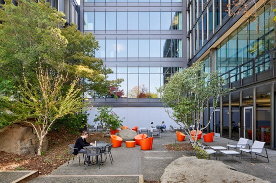 Thermochromic glass is integrated into the facades of the additions to control solar heat gain while maintaining a historically compatible aesthetic.