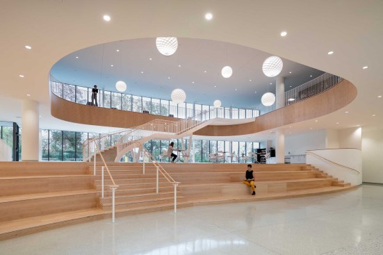 The atrium's large gap is representative of a peddle dropped in the river and opens. Curvature of millwork is also present in the atrium.