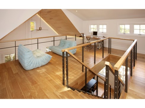 The spacious loft overlooks the living room and kitchen below.