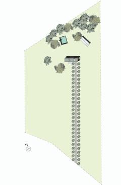 The house deals with the existing driveway axis indirectly. Behind the house are a farm shed and fireplace ruins from an old prefab house.