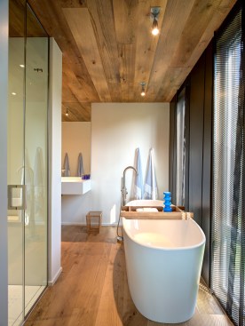 The perforated steel panels provide shade and privacy for the master bathroom, while still allowing natural light.