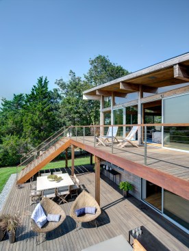 A new deck added to the back of the exterior home provides for interaction and connectivity to the outdoors.
