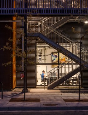 View into ground-floor office at dusk