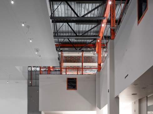 We+chose+to+expose+the+intersection+of+the+original+1933+building+and+the+1960s+addition.++The+uplighting+of+the+orange+steel+and+exposed+structure+celebrates+the+history+and+the+future.++