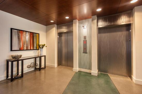 Elevator doors and transoms shown in Stainless Steel with Seastone finish and Campagne pattern at The Matisse, Portland, Oregon