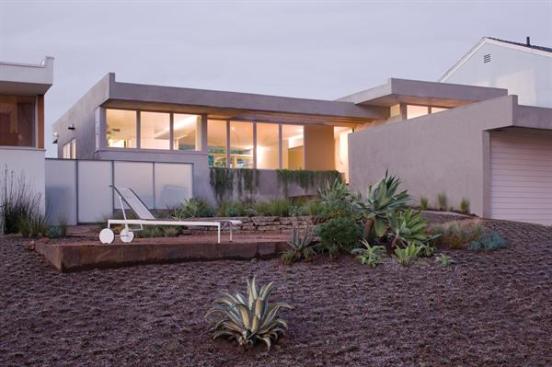 The new front yard features drought-tolerant plantings and a communal garden where neighbors sit and share coffee.