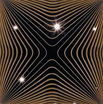 The+plywood+continues+to+the+ceiling%2c+where+it+conceals+mechanical+systems%2c+and+even+to+the+pedestals+that+support+the+tables.+