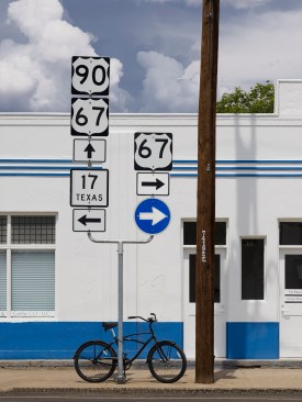 Partial+west+elevation+detail+showing+the+new+toilet+doors+and+window.++The+space+is+now+offices+for+TimeCar.++Most+people+travel+by+bicycle+in+Marfa.