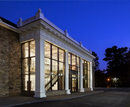 The concept of an enclosed porch becomes evident on performance nights when the lobby glows like a lantern.