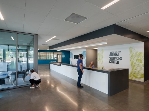 Large reception desk bisects the dog and cat zones and serves to orient visitors and volunteers to the new building. All accessible from the main building, other zones include Small Animals, The Barn, Animal Clinic, and the Community Center.