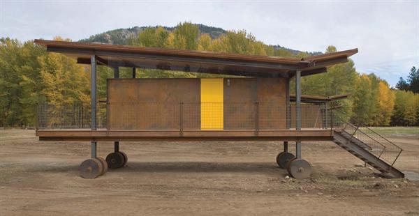 The idea for the rusted wheels more sculptural than practical grew out of a zoning issue that allowed only RVs on the property. 
