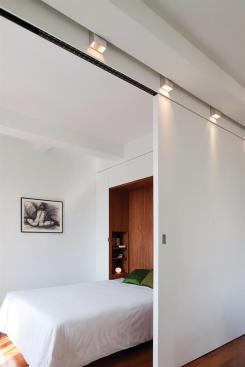 A large sliding door allows the owner to separate the sleeping area from the main living space.