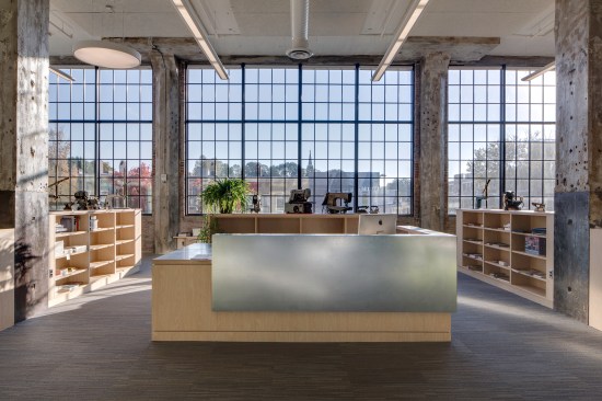 The+interior+aesthetic+tries+for+%22open+industrial+loft%22+with+the+exposed+walls+and+structure.